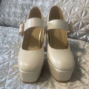 Mary Jane off white coloured platform blocked heels in a size 5